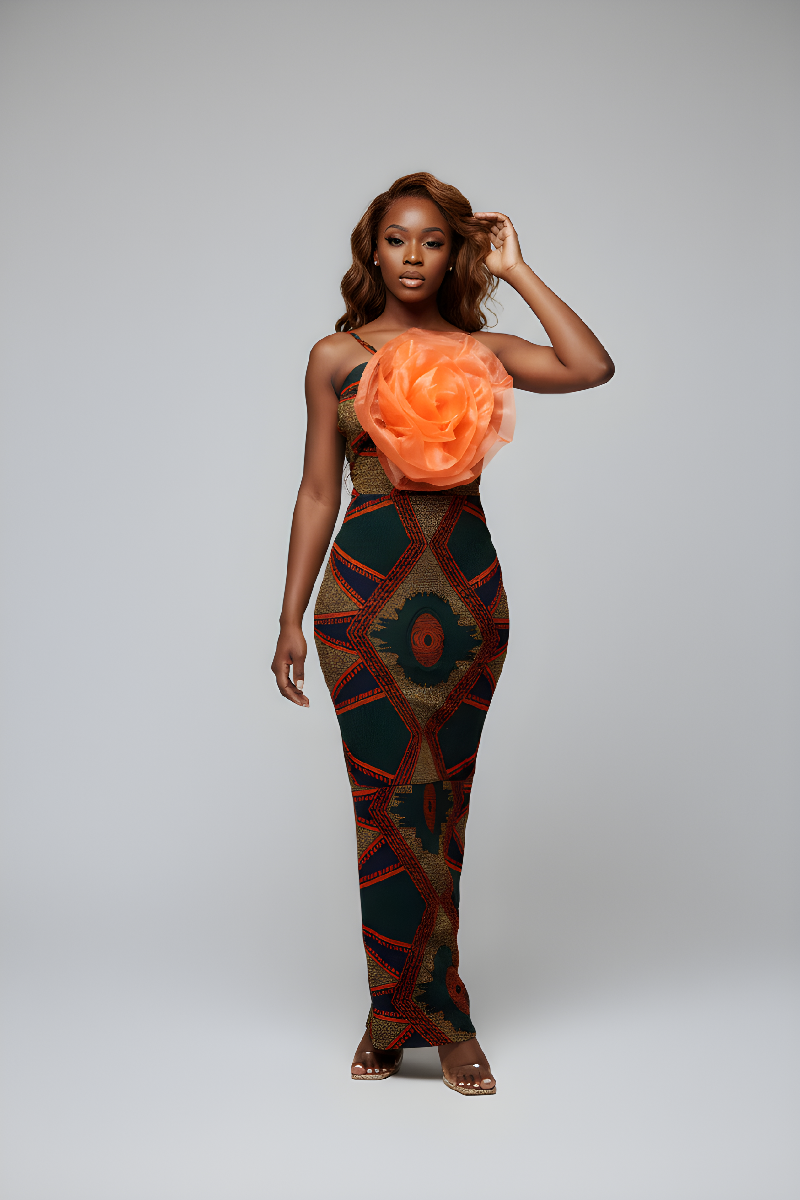 Turn heads in this gorgeous Ankara print maxi dress with beautiful flower details. A stunning African-inspired style for any special occasion. Shop at Fabby Glamtique.