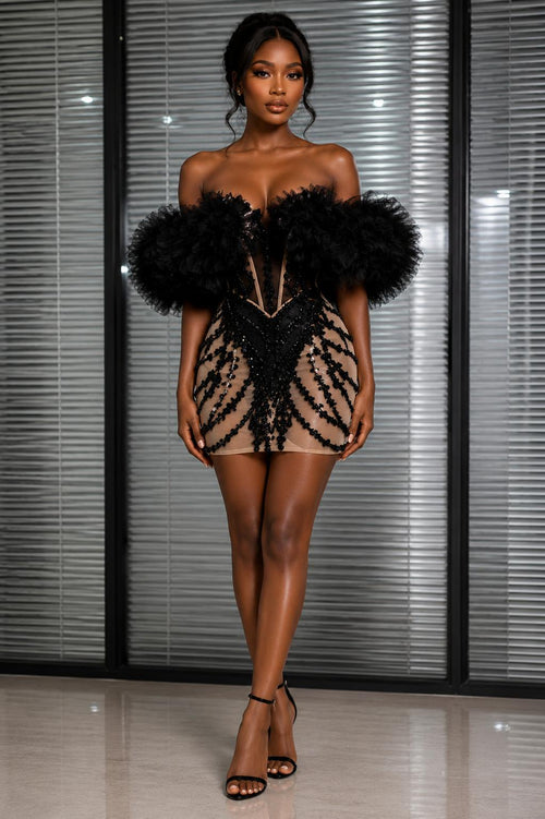 Black Rhinestone Cocktail Mini Dress worn by a model, featuring off-the-shoulder tulle sleeves and intricate rhinestone details.