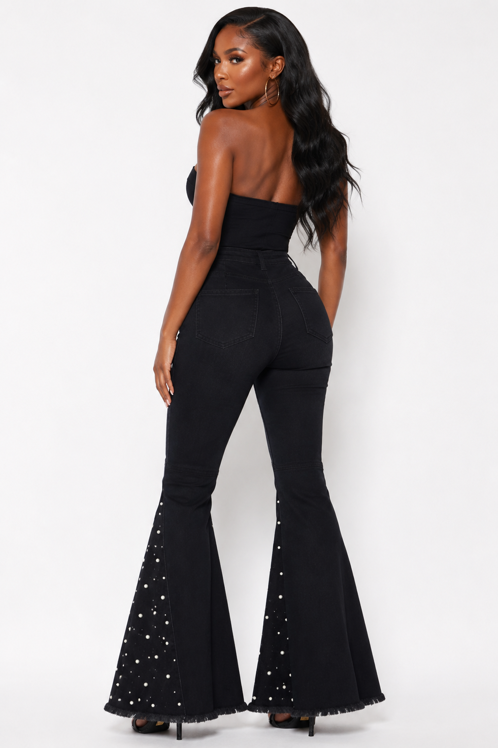 Back view of black pearl-studded high-waist bell bottom flare jeans
