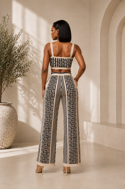 Woman wearing a three-piece wide leg pants set with modern geometrical print from the back.