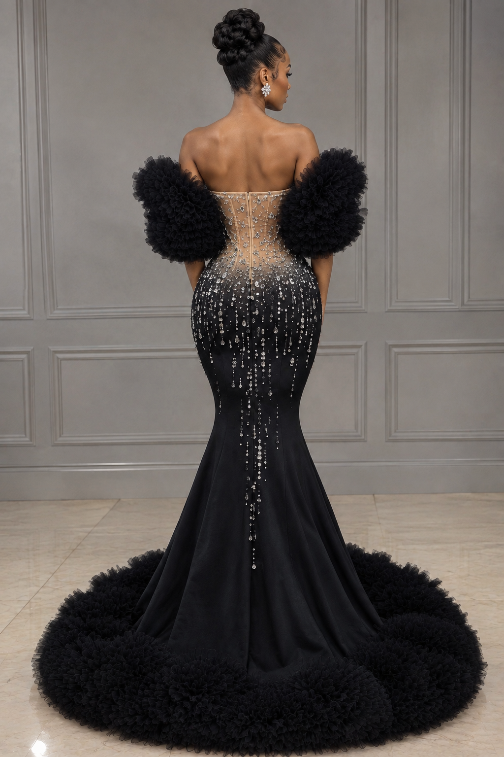 Back view of black crystal mermaid gown with sheer corset bodice and tulle-trimmed train