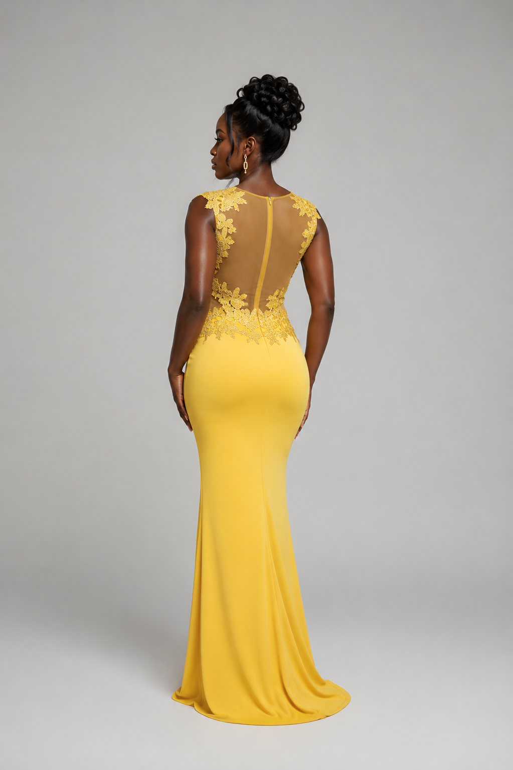 Stylish back view of the Yellow Embroidered Mermaid Evening Dress featuring intricate floral embroidery.