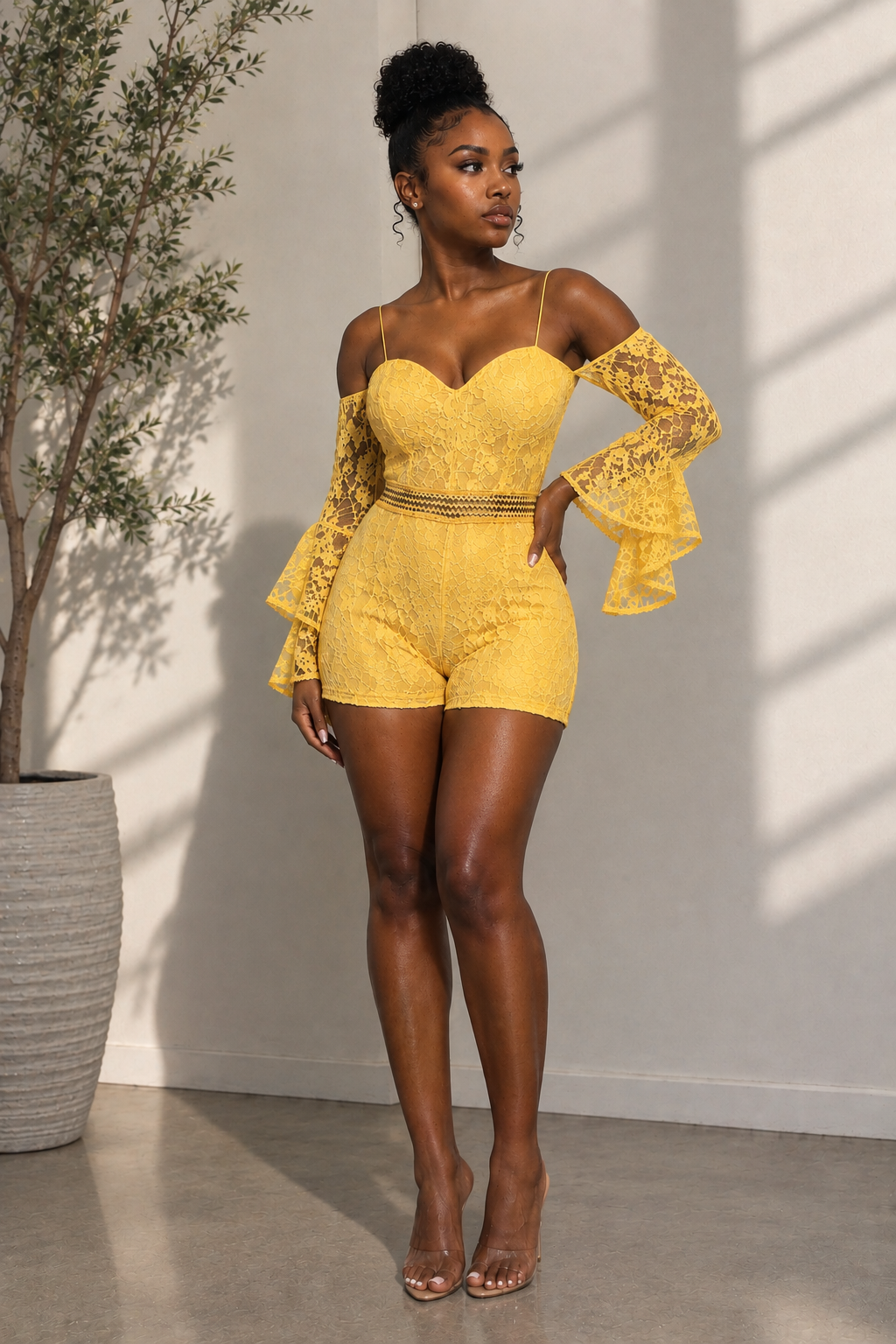Yellow lace off-shoulder romper shown from the front